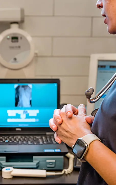 A dental X-ray reviewed on a laptop