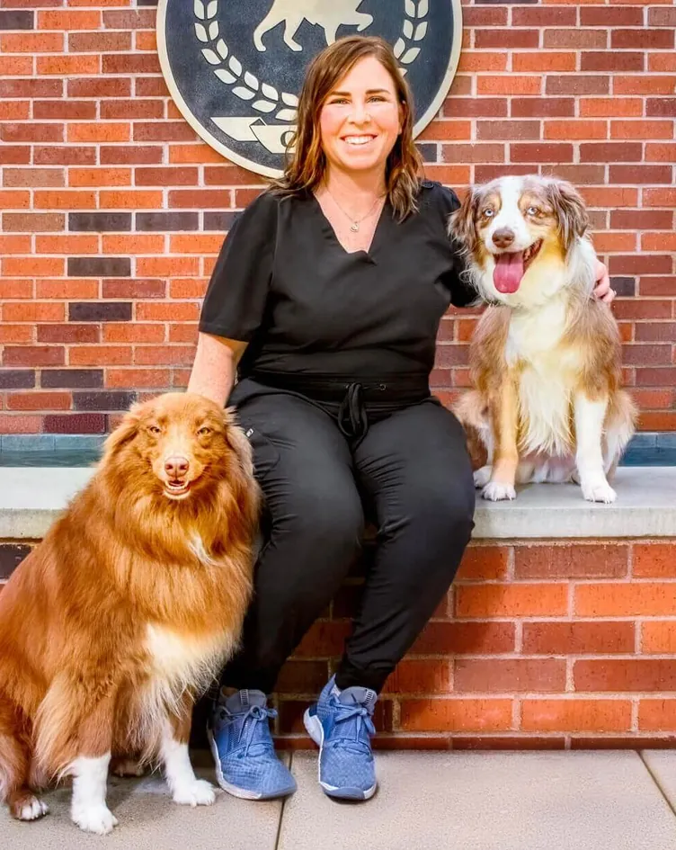 Ally Doughty, Client Care Coordinator, with a dog