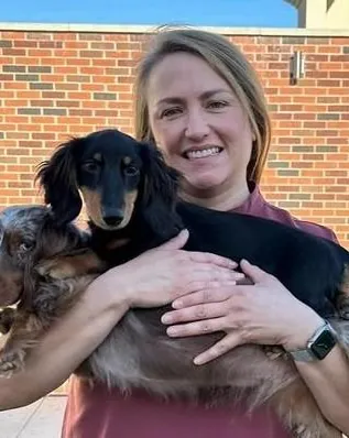 Dr. Amanda Henry, (DVM) Veterinarian, with a dog