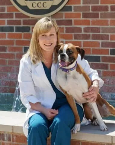 Dr. Heather Vargo, (DVM) Veterinarian, with a dog