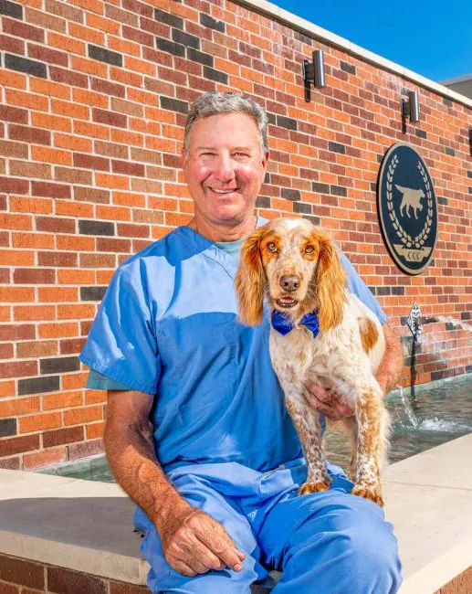 Dr. John Vandermeer, (DVM) Veterinarian, with a dog