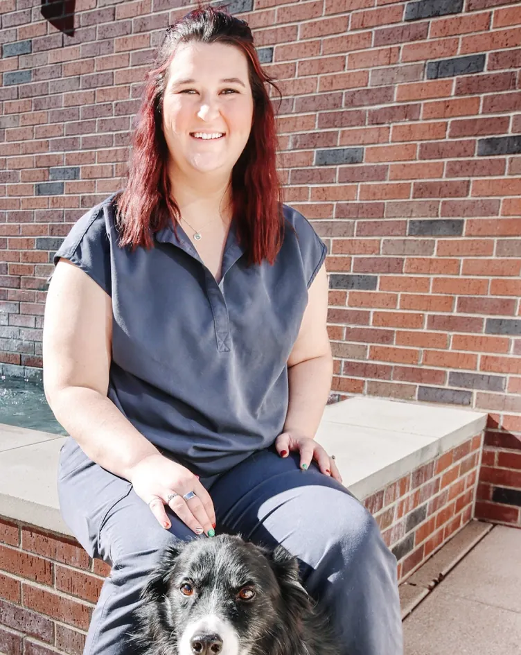 Sabrina Canada, Technical Coordinator, with a dog
